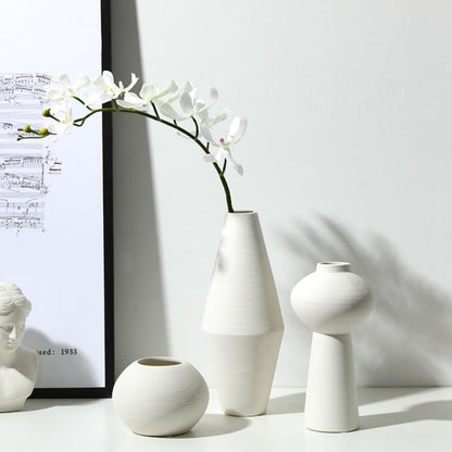 White three-piece ceramic decorative vase set