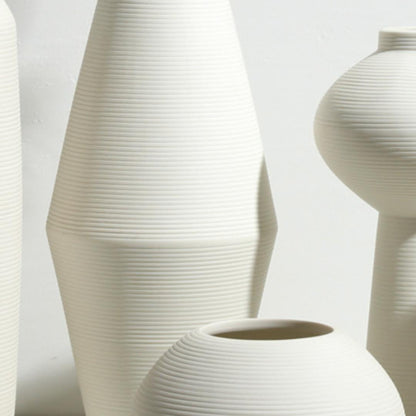 White three-piece ceramic decorative vase set